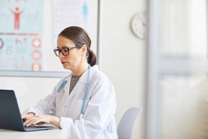 Doctor working with laptop at office