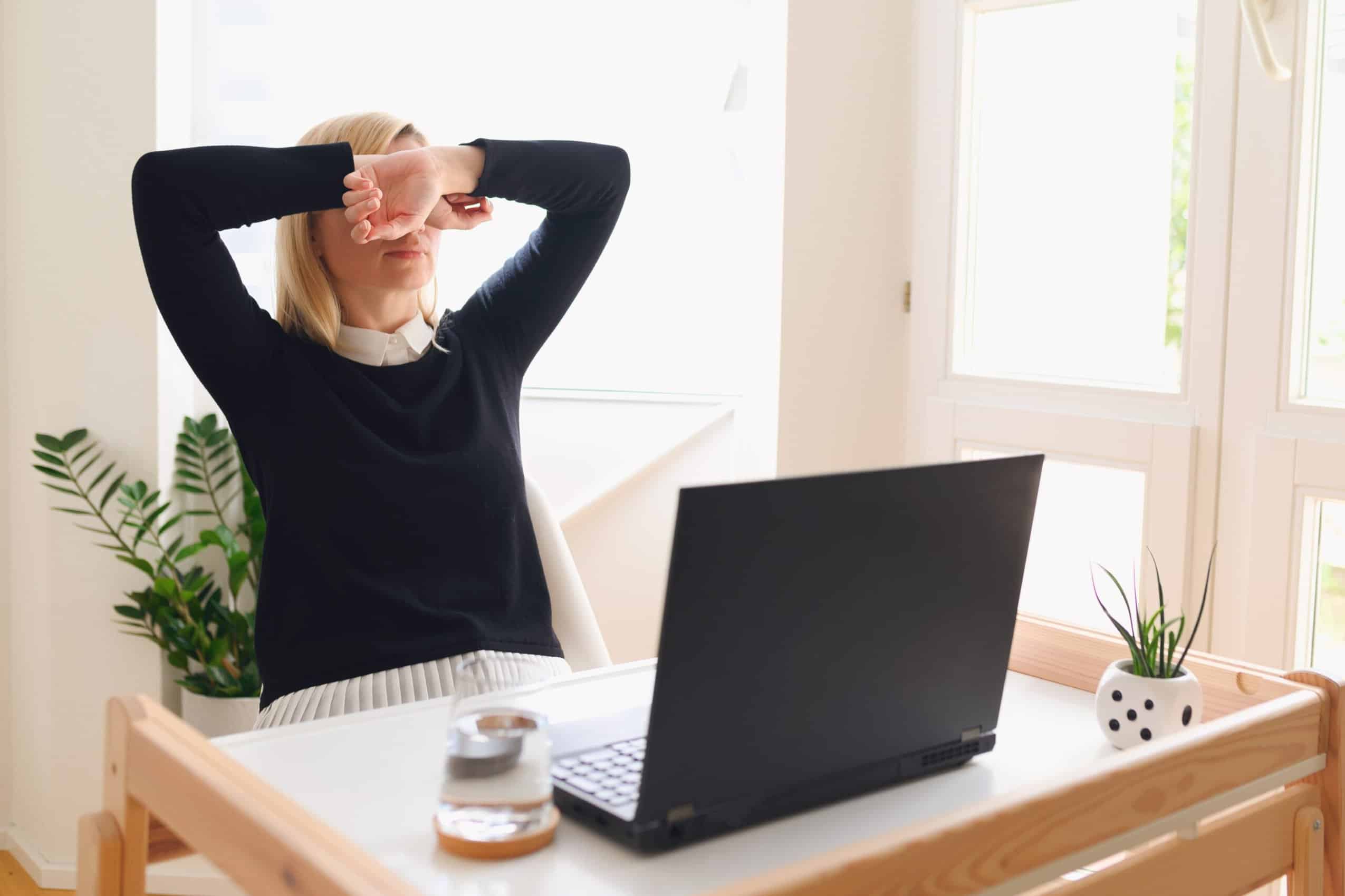 Frustrated business woman in front of her computer